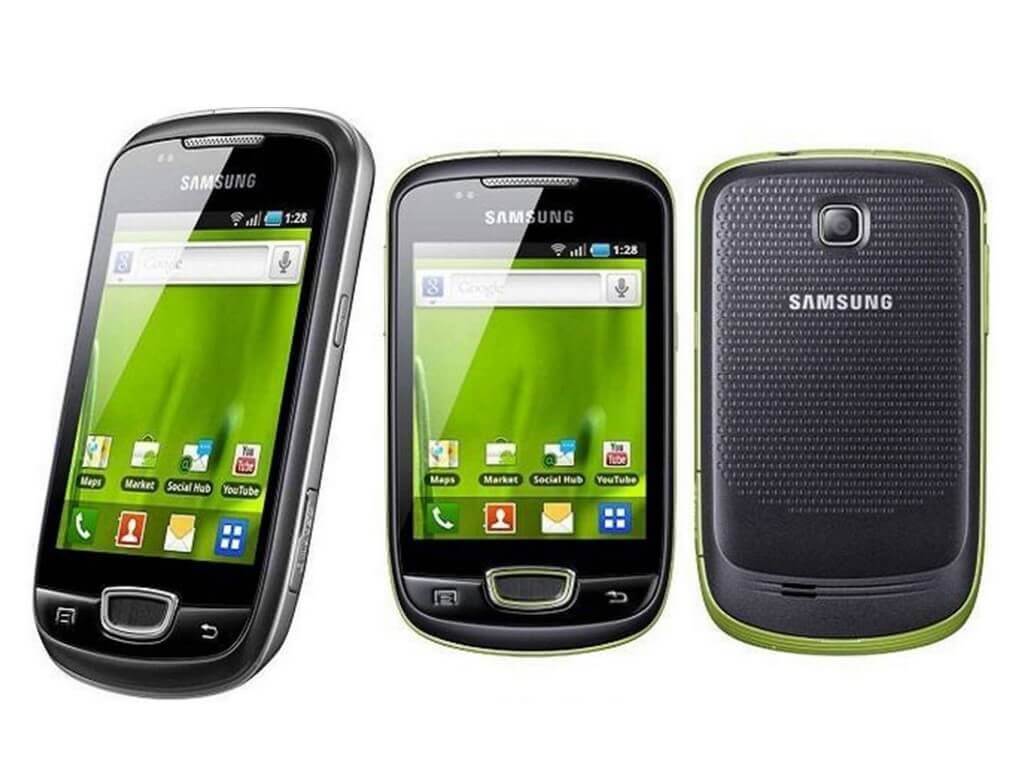 Glossy black phone with a grassy wallpaper